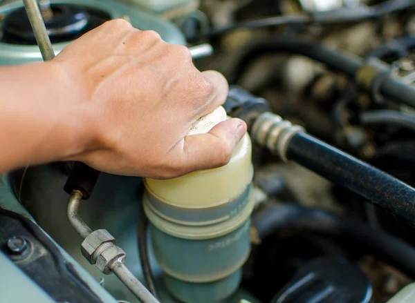 Mechanic repairs checking a car — Stock Photo, Image