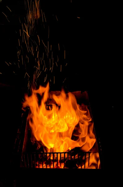 Fire in fireplace black background — Stock Photo, Image