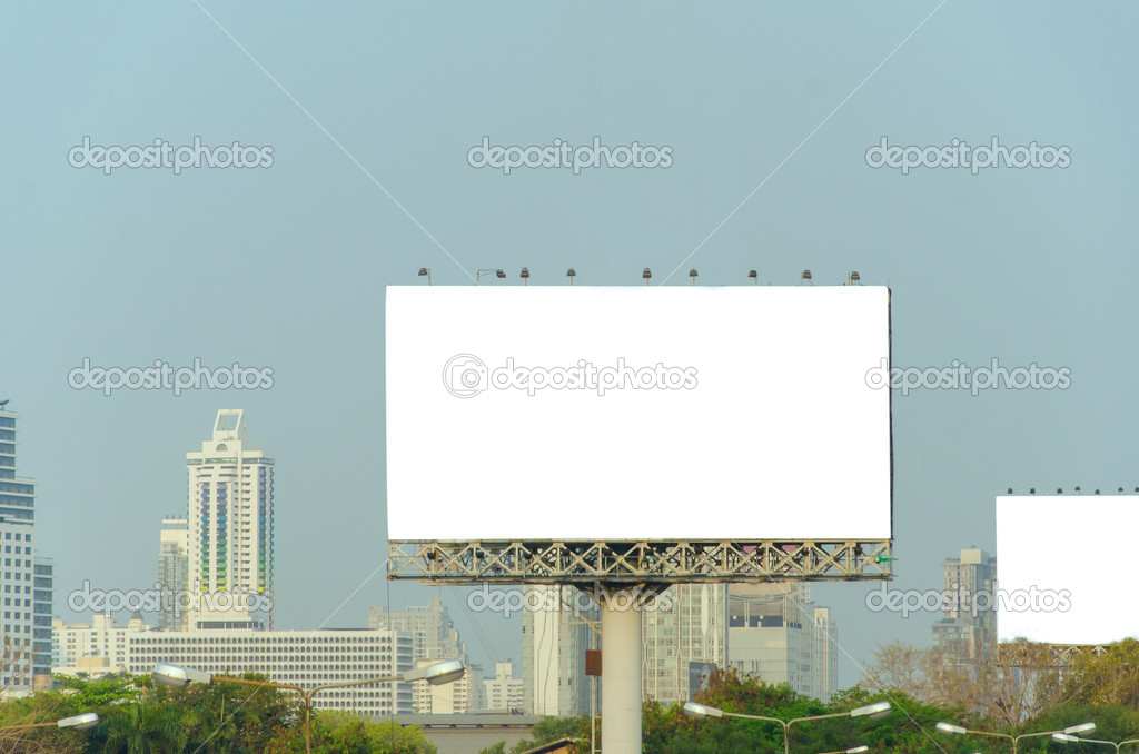 Large blank billboard with city view background