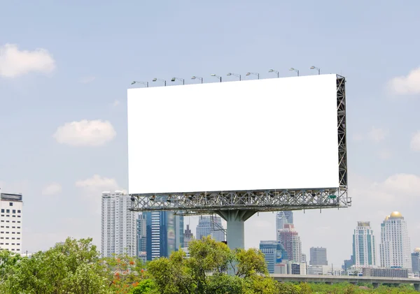 Large blank billboard on road with city view background — Stock Photo, Image