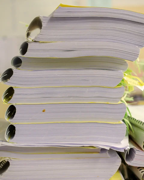 Pile of documents on desk stack up high waiting to be managed. — Stock Photo, Image