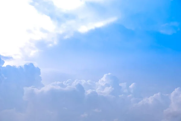 White cumulus clouds formation in blue sky season nature background