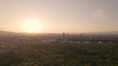 Aerial panorama at sunset over Sofia city, Bulgaria. Aerial drone view- Skyline of Sofia, Bulgaria at sunset from City Park