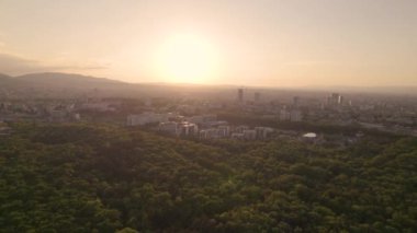 Aerial panorama at sunset over Sofia city, Bulgaria. Aerial drone view- Skyline of Sofia, Bulgaria at sunset from City Park