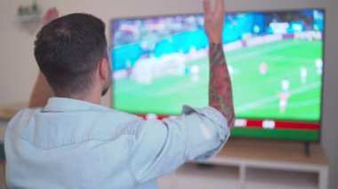 angry european football fan watching world cup 2022 qatar at home. High quality FullHD footage