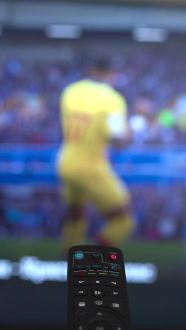 Vertical Video Remote Control Changing Different Football Matches Channels High — 图库视频影像
