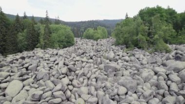 Stone river, rock landform natural wonder in Vitosha mountain in Bulgaria. Flying above stone run in Bulgaria. Stone river, scree, in Vitosha massif. National Park near Sofia. High quality 4k footage
