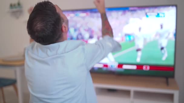 Slow Motion Cheering Happy Fan Celebrating Win Watching Blurry Home — Vídeos de Stock