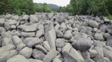 Stone river, rock landform natural wonder in Vitosha mountain in Bulgaria. Flying above stone run in Bulgaria. Stone river, scree, in Vitosha massif. National Park near Sofia. High quality 4k footage
