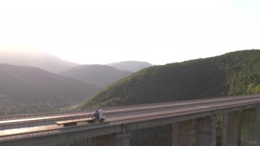 Panorama landscape of highway road between mountains at sunny day. Transportation scene. Freeway road aerial view. Brazilian road landmark. Sea mountain. High quality 4k footage