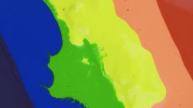 Colorful paint drops mixing in water. Ink swirling underwater. Liquid paint colorful bubbles patterns of moving surface
