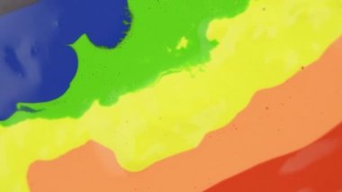Colorful paint drops mixing in water. Ink swirling underwater. Liquid paint colorful bubbles patterns of moving surface
