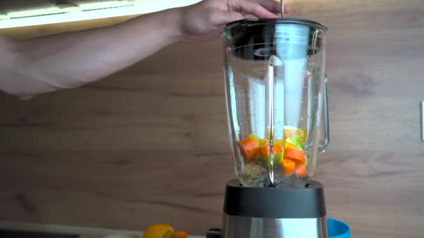 Young Healthy Man Putting Fruits His Blender Morning Male Hands — Vídeo de stock