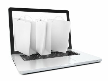 laptop ve Beyaz alışveriş torbaları üzerinde beyaz izole