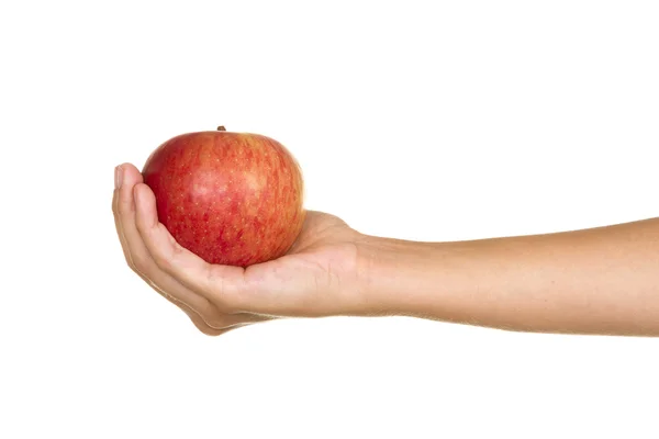 Hand med ett rött äpple — Stockfoto
