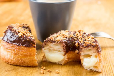 donut cronut on a wodden table clipart