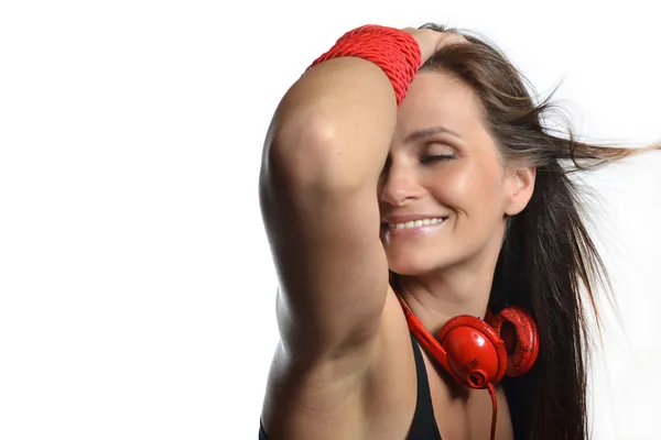 A beautiful young woman with the red headphones — Stock Photo, Image