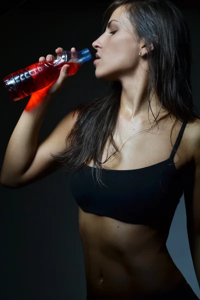 Beautiful woman with energy drink — Stock Photo, Image