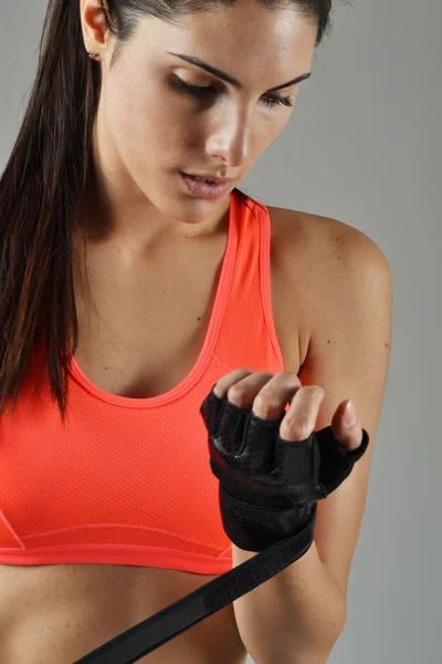 Beautiful fitness woman with the black boxing bandage — Stock Photo, Image