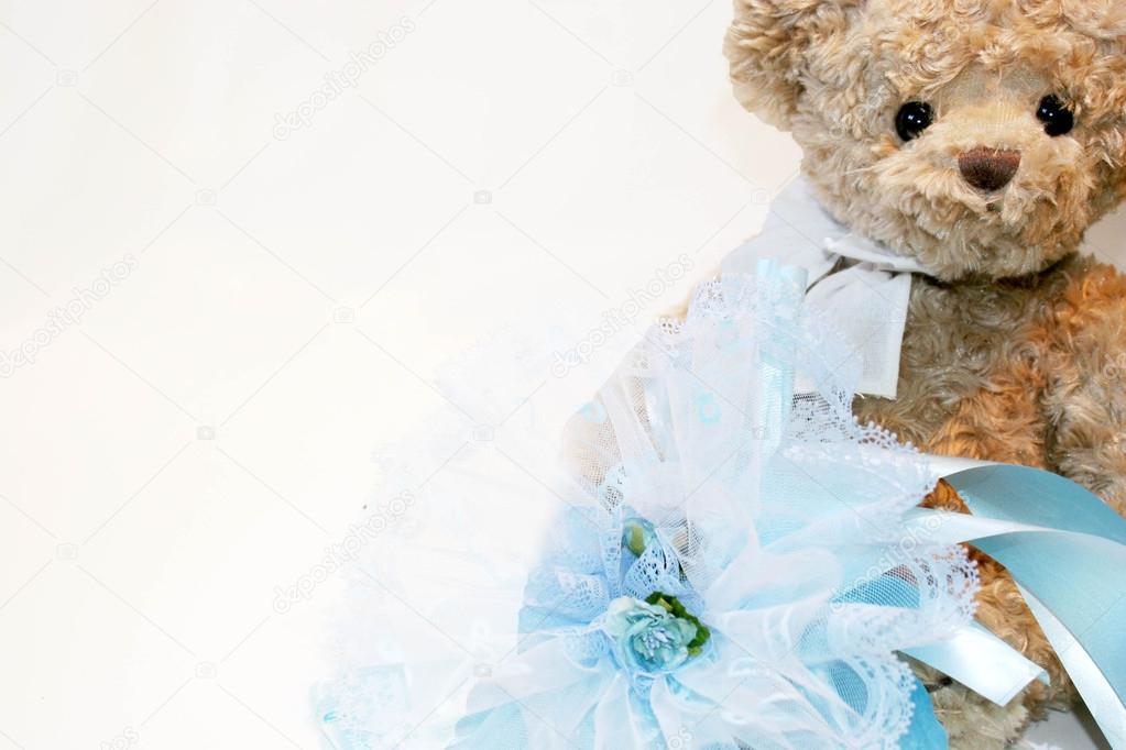 teddy bear with blue ribbon