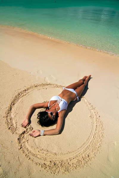 The beautiful sexy young girl in bikini on a beach — Stock Photo, Image