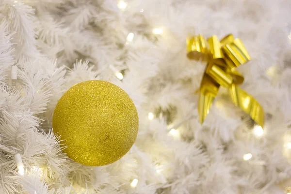 Yellow Christmas bulbs and silver tree — Stock Photo, Image