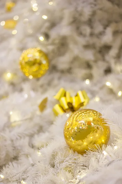 Yellow Christmas bulbs and silver tree Royalty Free Stock Images