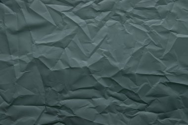 Buruşmuş kağıt. Kara Orman Yeşili ve Dış Mekan Renkleri. yüksek çözünürlüklü detaylı doku. Duvar kağıdı için soyut arkaplan.