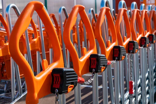 Shopping Trolleys Orange Handles Lined Hardware Store Close — Stock Photo, Image