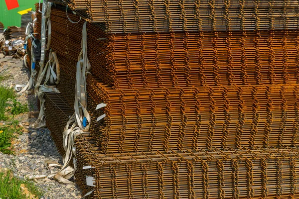Reinforcing mesh stacked on a construction site. Close up.