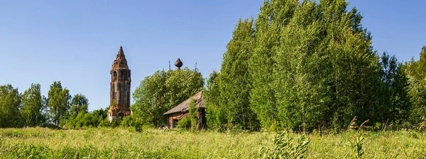 landscape of a ruined village church, the village of Isupovo, Kostroma province, Russia. The year of construction is 1740. Currently, the temple is abandoned.