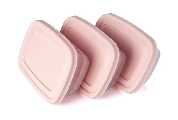 Három Műanyag Élelmiszer Tároló Tartály Rózsaszín Fedéllel Fehér Háttér Asztalon — Stock Fotó