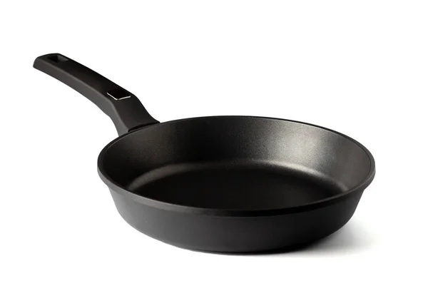 Frying pan with non-stick coating isolated on white background. New kitchen utensil cookware. Close up Stock Photo