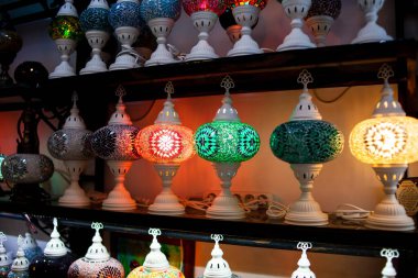 Traditional handmade multicolor Turkish, Moroccan, Arabian lamps. Mosaic style and colored glass lantern. Turkish lamps in souvenir shop in Turkey