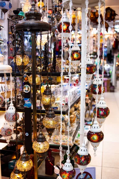 Traditional handmade multicolor Turkish, Moroccan, Arabian lamps. Mosaic style and colored glass lantern. Turkish lamps in souvenir shop in Turkey