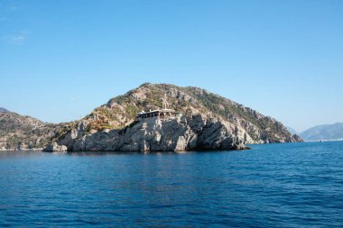 Restaurant in a remote location on mountain rock in the sea. Rock Restaurant over the sea. Marmaris, Turkey - September 8, 2022