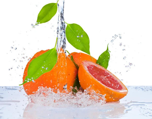 Fresh orange in water splash — Stock Photo, Image