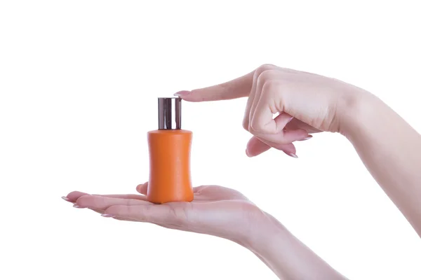 Perfume in her hands. — Stock Photo, Image