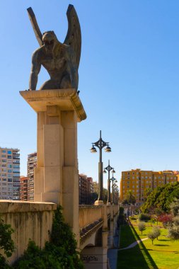 Valencia, Spain. April 3, 2022 - The guardian, or gargoyle, of the Pont del Regne, or kingdom bridge, in valencian language, by the sculptor Joan Marti. The bridge made by Salvador Monleon in 1999