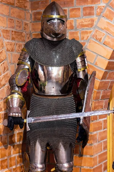 Old historical medieval iron knight armor for ancient warriors protection in combat. Traditional past fighter heavy metal defense equipment in battle or tournament.