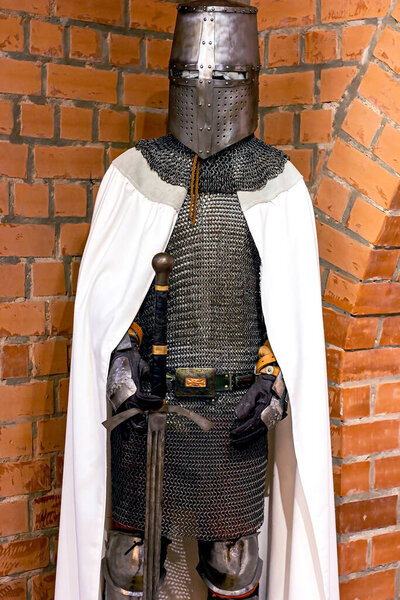 Old historical medieval iron knight armor for ancient warriors protection in combat. Traditional past fighter heavy metal defense equipment in battle or tournament.