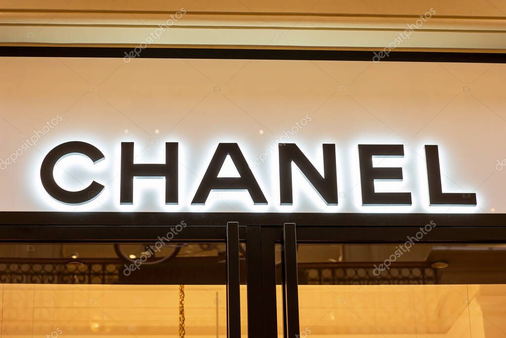 MOSCOW, RUSSIA - AUGUST 10, 2021: Chanel brand retail shop logo signboard on the storefront in the shopping mall.