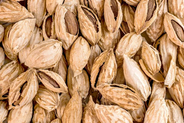 Brown Dry Unpeeled Almond Nuts Food Textured Background — Stock Photo, Image