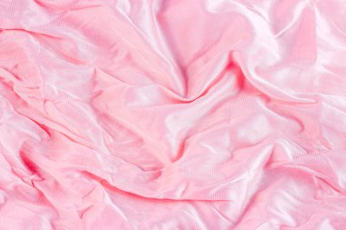 Açık renkli pembe renkli dalgalı naylon ve yumuşak desenli arka plan olarak poliyamit tekstil deseni. Soluk renkli yumuşak kumaş örtüsü..