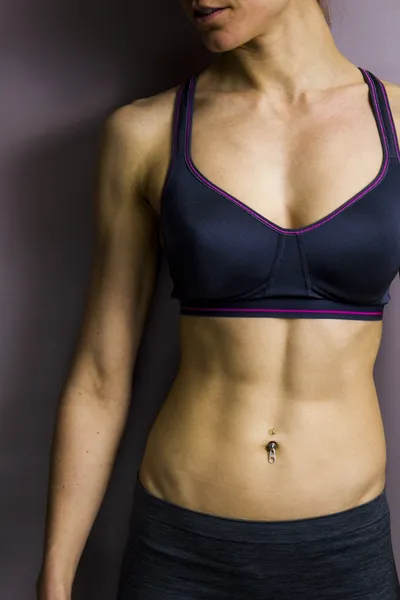 Athletic female abs — Stock Photo, Image