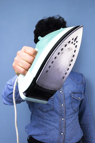 Man with iron — Stock Photo, Image