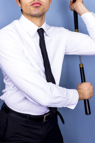 Uomo d'affari con nunchaku — Foto Stock