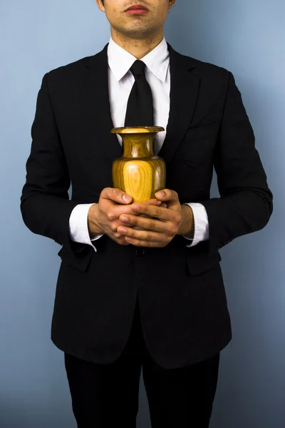 Man with wooden urn — Stock Photo, Image