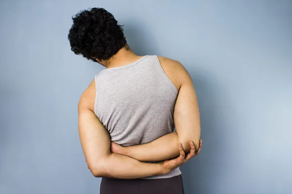 Young mixed race man in side stretch — Stock Photo, Image