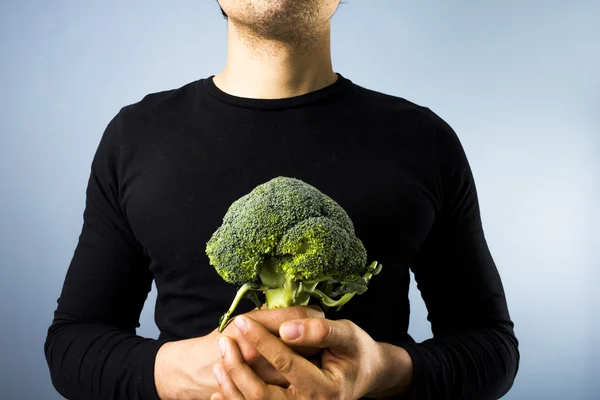 Man with broccoli — Stock Photo, Image